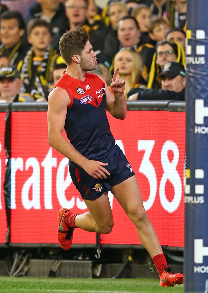 AFL 2016 Rd 05 - Melbourne v Richmond MELBOURNE, AUSTRALIA - APRIL 24: Tomas Bugg of the Demons gestures to Tigers supporters in the crowd as he celebrates after kicking a goal during the 2016 AFL Round 05 match between the Melbourne Demons and the Richmond Tigers at the Melbourne Cricket Ground, Melbourne on April 24, 2016. (Photo by Scott Barbour/AFL Media)